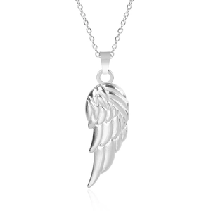 Detailed macro view of silver angel wing pendant in polished 18k plated stainless steel