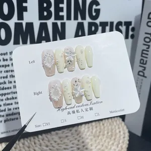 Handmade press-on nails with pearl, cat-eye stone, and 3D floral luxury nail art set