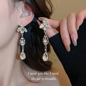 Sparkling crystal teardrop tassel earrings with pink diamond and silver finish