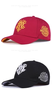 Detail of embroidered Wolf-M badges and abstract patterns on cotton baseball caps