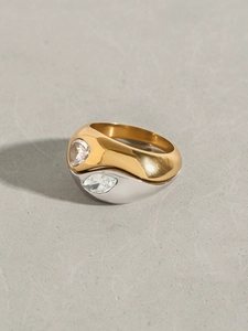Macro shot of two-tone stainless steel layered ring with sparkling white zirconia stones