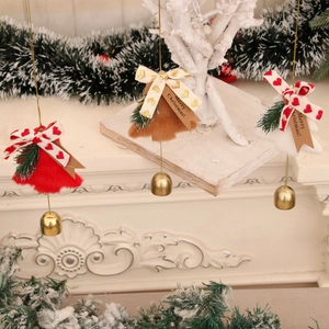 Detail of Christmas bell hangers with plush texture, pine cones and Merry Christmas tags