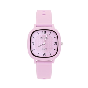 Detail view of pink square dial quartz watch with silicone strap and Arabic numbers