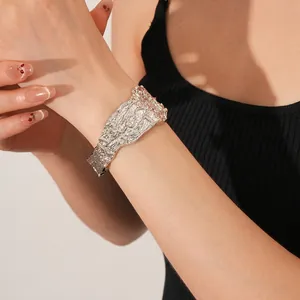 Modern wide cuff bracelet with irregular lava texture in silver minimalist style