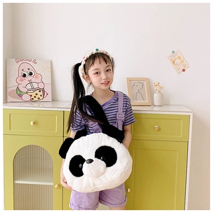 Detail of soft plush panda shoulder bag with fluffy texture and cute animal facial features