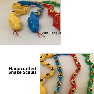 Close-up of flexible plastic snake toy featuring colorful jointed segments and scales
