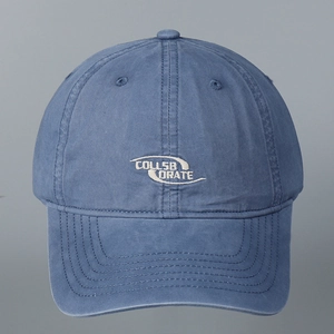 Classic washed cotton baseball cap in vintage blue with white Collaborate embroidery