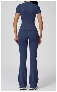 Detail of slim fit navy blue yoga set showing back seams and flared pants texture