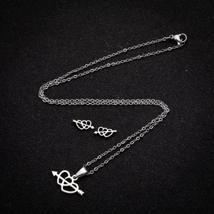 Stainless steel jewelry set featuring heart and arrow pendant necklace and matching studs