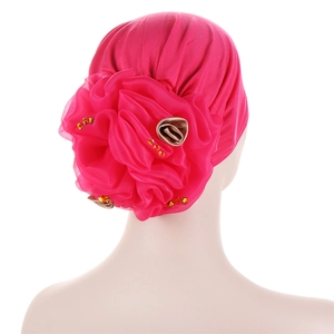 Detailed back view of magenta turban hat with 3D floral applique and crystal accents