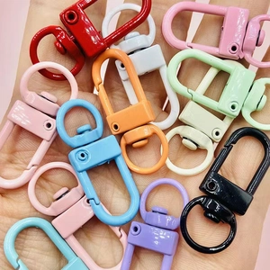 Close-up of colorful metal lobster clasps for handmade tulip flower keychains