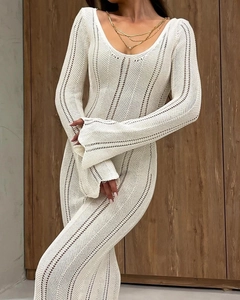 Detailed knit texture of white V-neck slim crochet dress with elegant bell sleeves