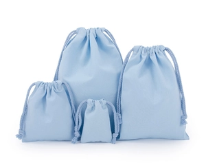 Set of four light blue drawstring cotton pouches in various sizes for eco-friendly storage