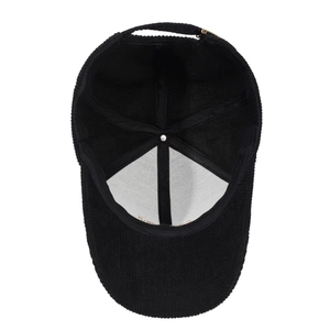 Bottom view of black corduroy baseball cap with structured panels and metal buckle