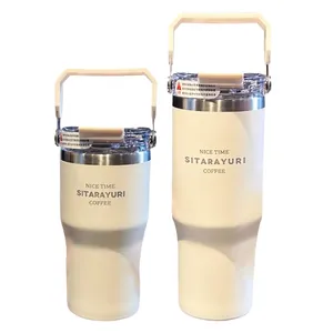 Large vacuum insulated coffee mug with handle and straw in matte cream white finish