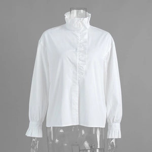 Detail of ruffled stand-up collar and vertical frill placket on a white cotton shirt