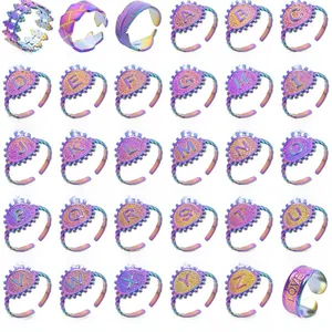 Detailed catalog of iridescent stainless steel rings featuring letters and vintage patterns