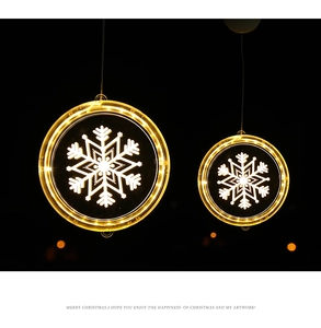 Close-up of dual-size LED snowflake hanging lights with warm white glow for Christmas decor