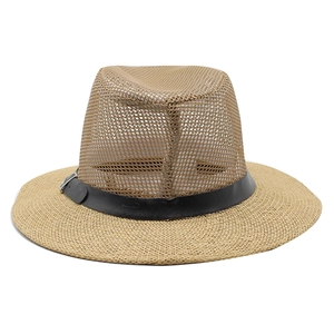 Detail of khaki mesh crown and woven straw brim on summer men's sun hat