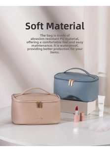 Detailed view of beige and blue PU leather cosmetic bags with dual zippers and gold lettering