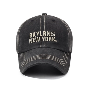 Vintage washed denim baseball cap with white embroidery and contrast stitching details