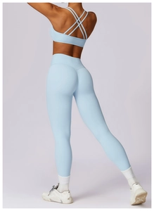 Rear view of light blue yoga set featuring cross-back sports bra and high-waist leggings