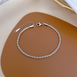Detail of silver titanium steel chain bracelet with lobster clasp and extender