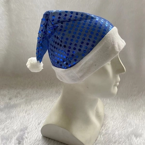 Detail of blue sequined Christmas hat with white plush trim on mannequin head