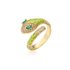 Macro detail of gold snake ring featuring green enamel scales and white zircon pavé