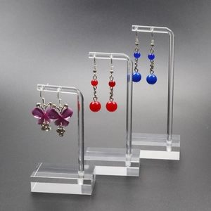 Three-piece clear acrylic earring display stands for jewelry organization and retail