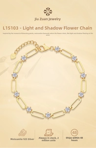 Detail of S925 sterling silver lobster clasp with heart charm and moissanite links