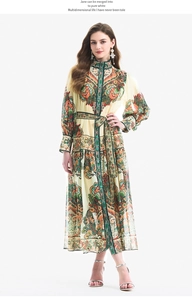 Detail of bohemian paisley print on lantern sleeve dress with matching waist tie