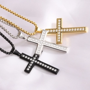 Detailed view of 26mm cross pendants in gold, silver, and black with sparkling zircons