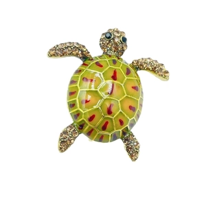 Exquisite sea turtle brooch with green enamel shell and sparkling brown crystals
