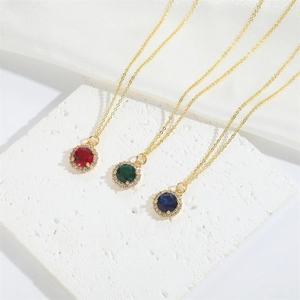 Three-piece halo necklace set with red, green, and blue zircon pendants in gold plating
