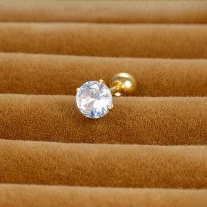 Macro shot of 4-prong round zircon stud earring with gold finish and ball screw back