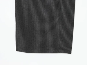 Detailed close-up showing the fine white vertical stripes on dark gray midi dress fabric