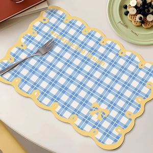Waterproof blue and white checkered faux leather placemat with yellow wavy edges