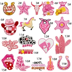 Detailed embroidery texture of pink western cowgirl patches with sequins and thread patterns