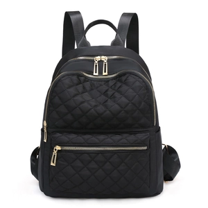 Black quilted oxford fabric backpack with golden zippers and adjustable straps