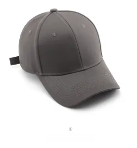 Detailed top view of a dark grey cotton baseball cap with ventilation eyelets and stitching