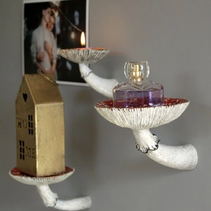 Three creative red mushroom wall shelves made of resin for stylish home decor display