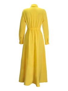 Back view of yellow maxi shirt dress featuring elastic waist and flared hemline
