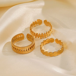 Three-piece gold adjustable ring set with fishbone and geometric cutout designs