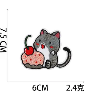 Detailed view of grey cat and cupcake embroidery patch with 7.5cm by 6cm size dimensions