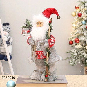 Close-up of a 12-inch Santa doll with a grey fur coat, metal glasses, and wooden staff