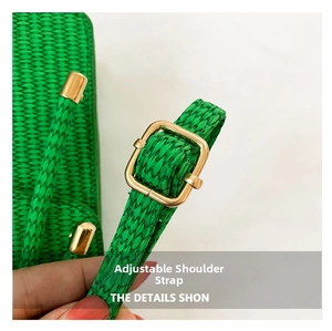 Detail showing adjustable strap with gold square buckle on green woven handbag