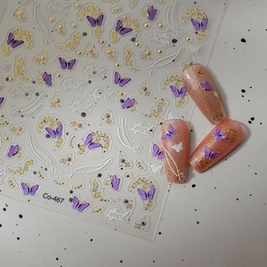 3D bronzing butterfly nail stickers with gold floral curves and purple accents