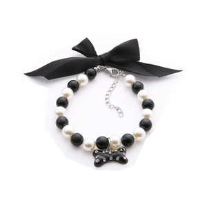 Elegant pet pearl necklace with black bow and rhinestone bone pendant for small dogs