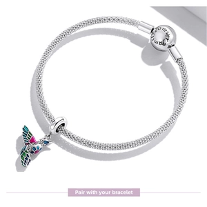 Macro detail of S925 silver hummingbird charm on mesh bracelet with Forever Family clasp